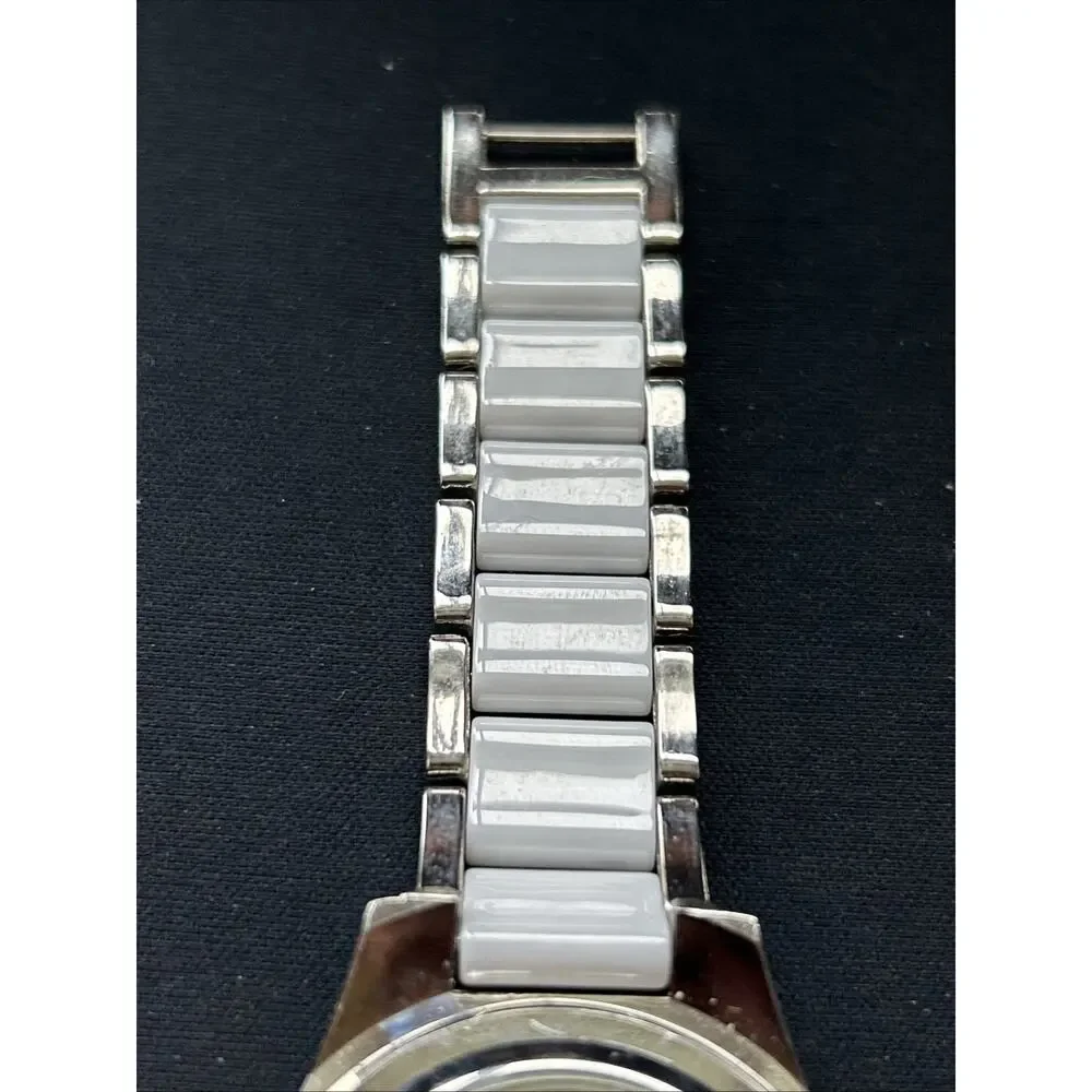 Burgi White And Silver Tone Rhinestone Bezel Women’s Quartz Watch